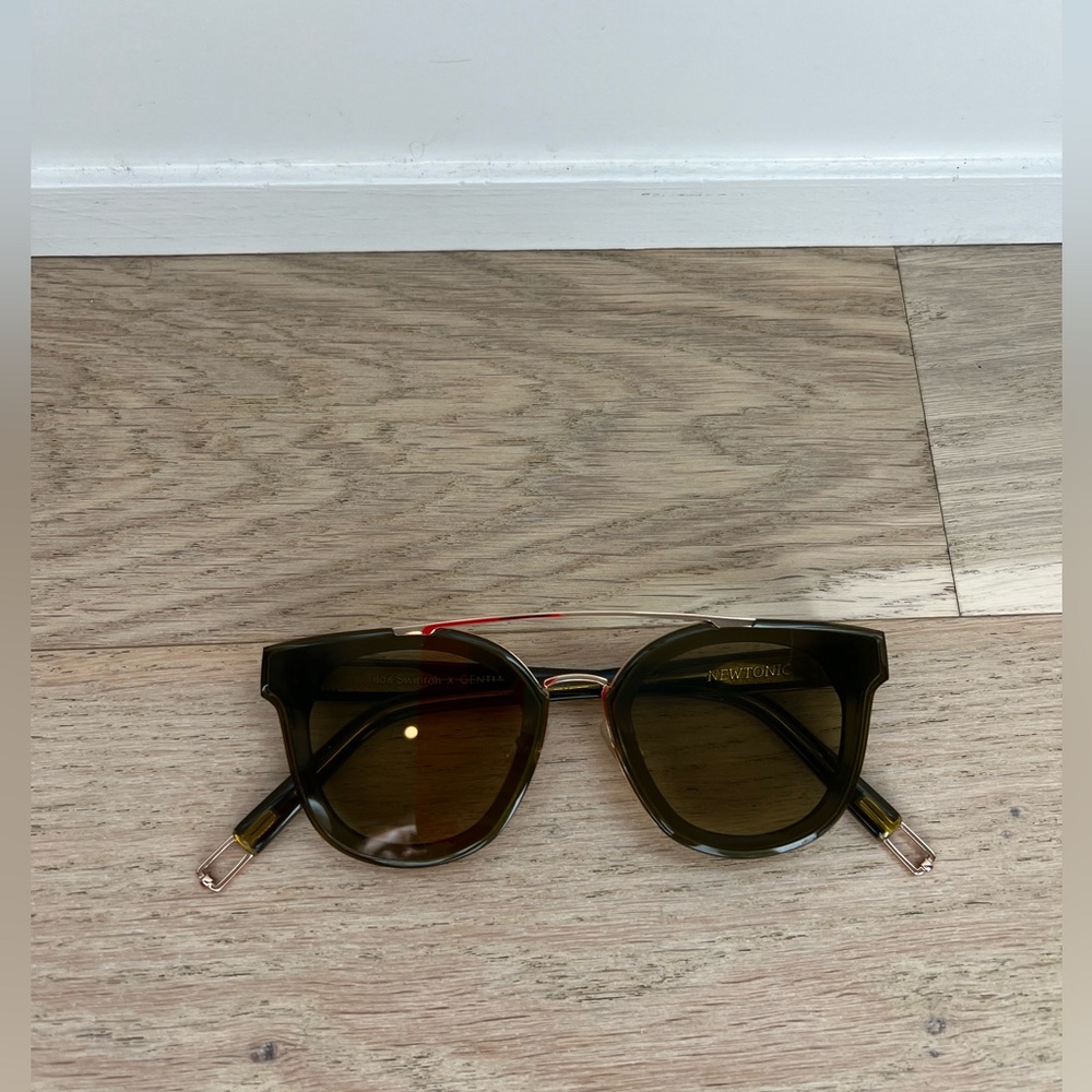 Gentle Monster x Tilda Swinton olive green and gold sunglasses